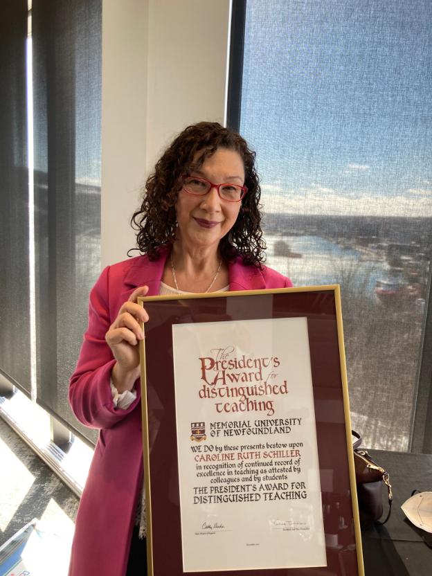 Caroline Schiller holding President's Award